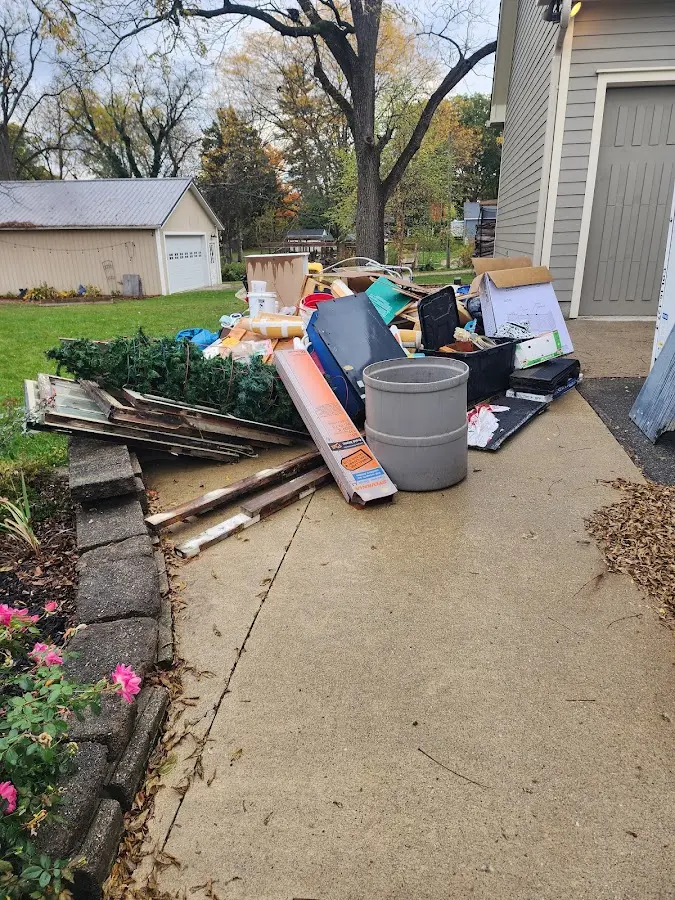Dumpster being loaded with debris for 30 Yard Dumpster Rental in North Tustin